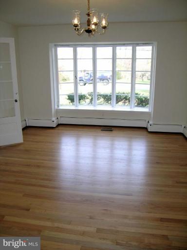 9217 Frederick Road Ellicott City, MD 21042 - Photo 12 of 22 a view of room with window and hardwood floor