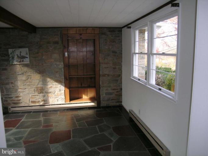 9217 Frederick Road Ellicott City, MD 21042 - Photo 5 of 22 a view of empty room with a window