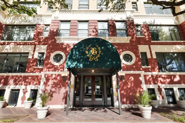 a view of a building with sitting area