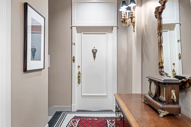 a view of an entryway with wooden floor
