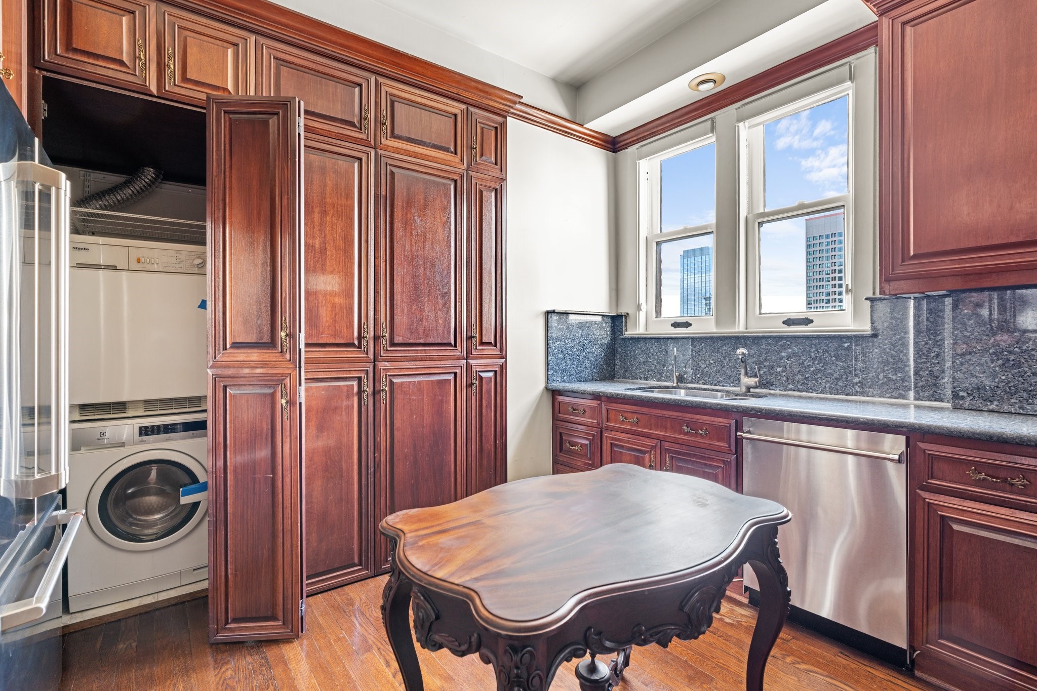 1700 Main Street, Unit 7B Houston, TX 77002 - Photo 26 of 50 a kitchen with a sink appliances and cabinets