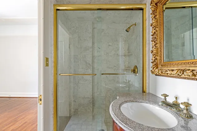 a bathroom with a sink and shower