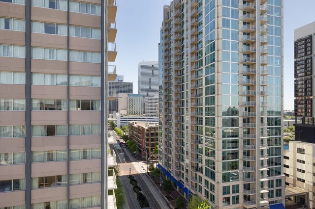 an aerial view of a house with a yard and seating space