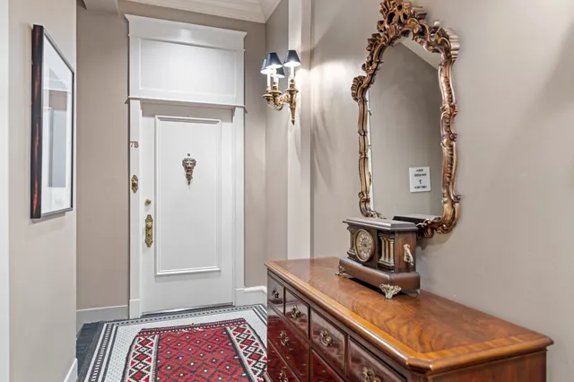 a view of room with a table and a chandelier