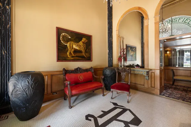 a living room with furniture gym equipment and a rug