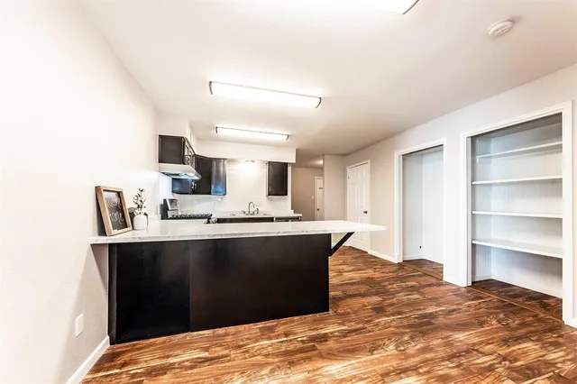 a view of kitchen with sink and window
