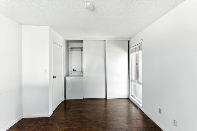 an empty room with wooden floor