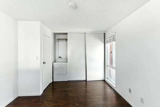 an empty room with wooden floor
