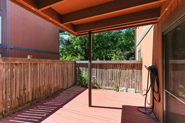 a view of a balcony with wooden floor