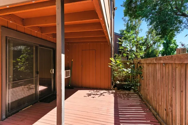 a view of a door and wooden floor