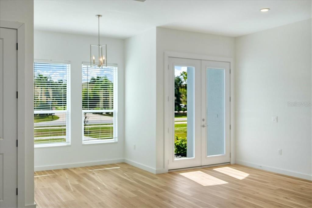 1215 Rio De Janeiro Avenue Punta Gorda, FL 33983 - Photo 40 of 65 a view of an empty room with window wooden floor and cabinet