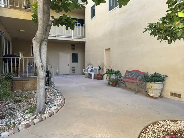 a front view of a house with outdoor seating