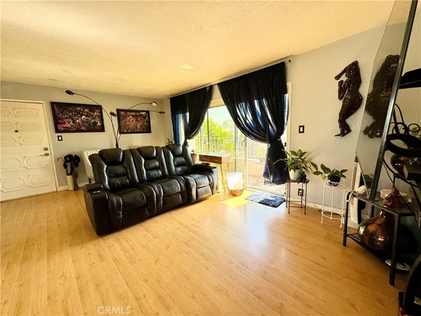 a living room with furniture fireplace and a flat screen tv