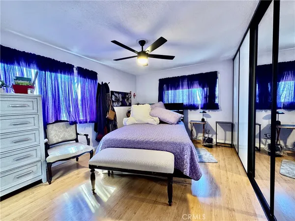 a bed room with a bed and a television