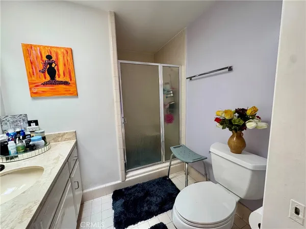 a white toilet sitting next to a bathroom sink