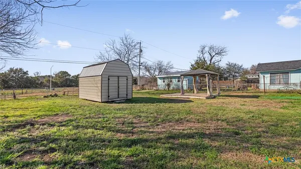 a house view with a garden space