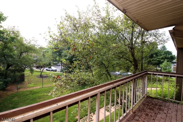 a view of balcony with yard