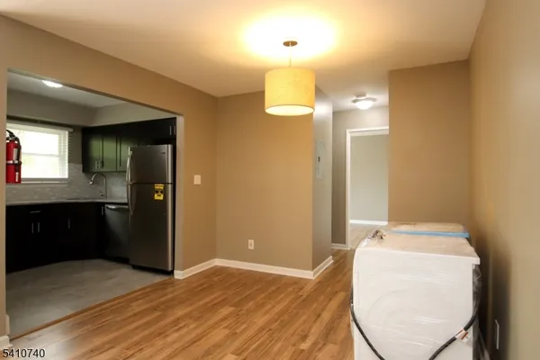 a view of a bathroom with a sink mirror and shower