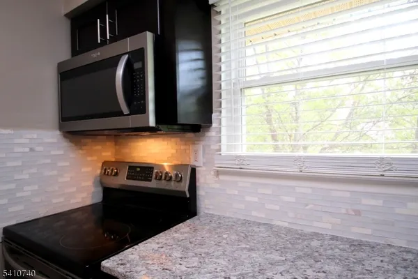 a kitchen with a stove and a microwave