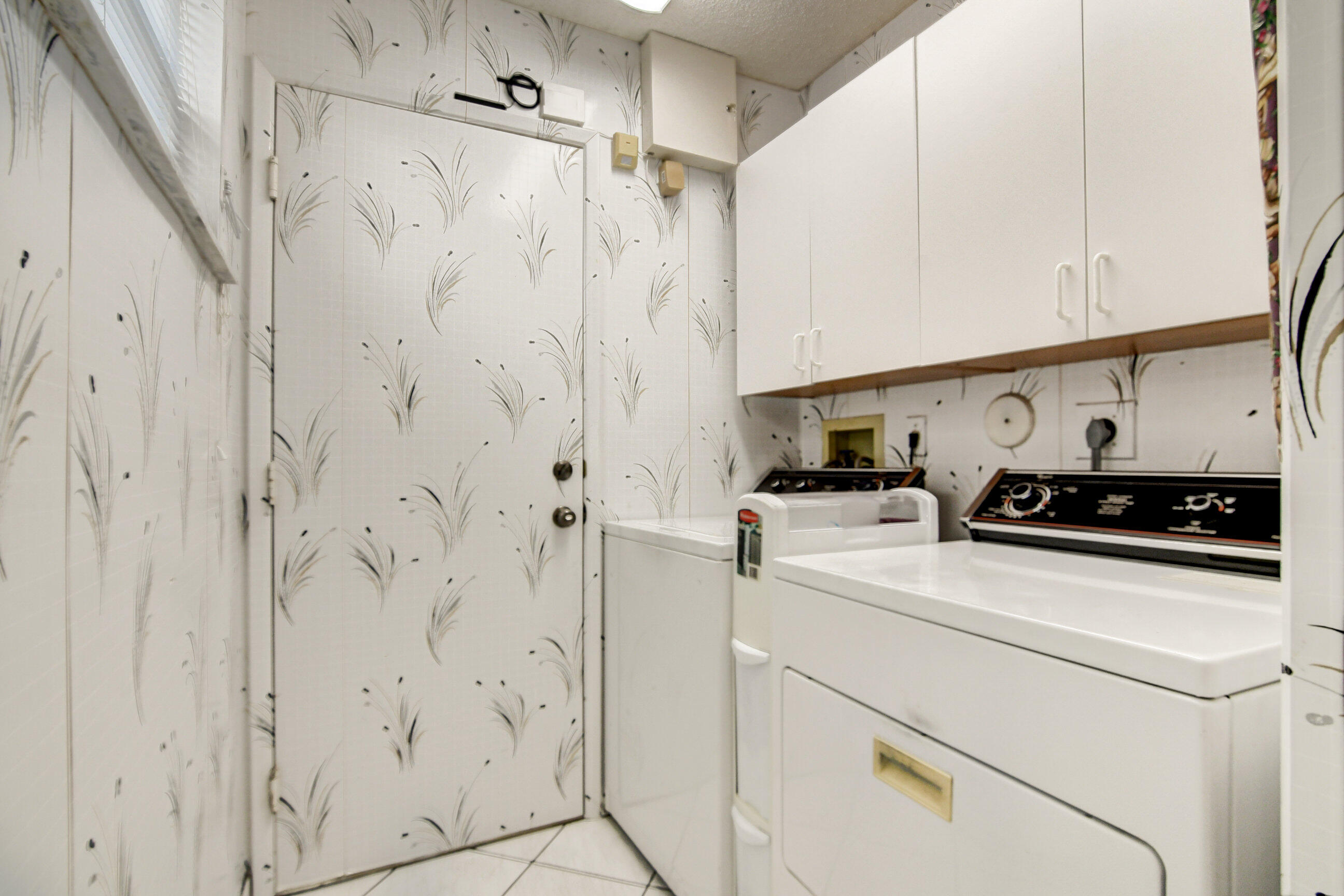 6359 Mill Pointe Circle Delray Beach, FL 33484 - Photo 25 of 57 Designated laundry room w/window