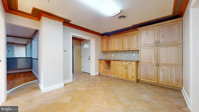 a view of a bedroom with wooden floor and bathroom