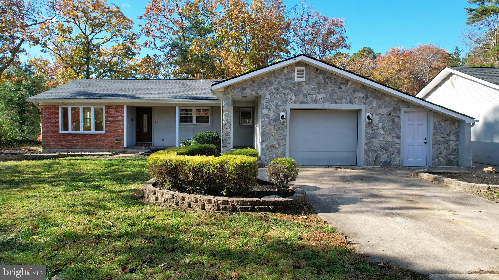 119 East Collings Drive Williamstown, NJ 08094 - Photo 2 of 61 a house view with a garden space