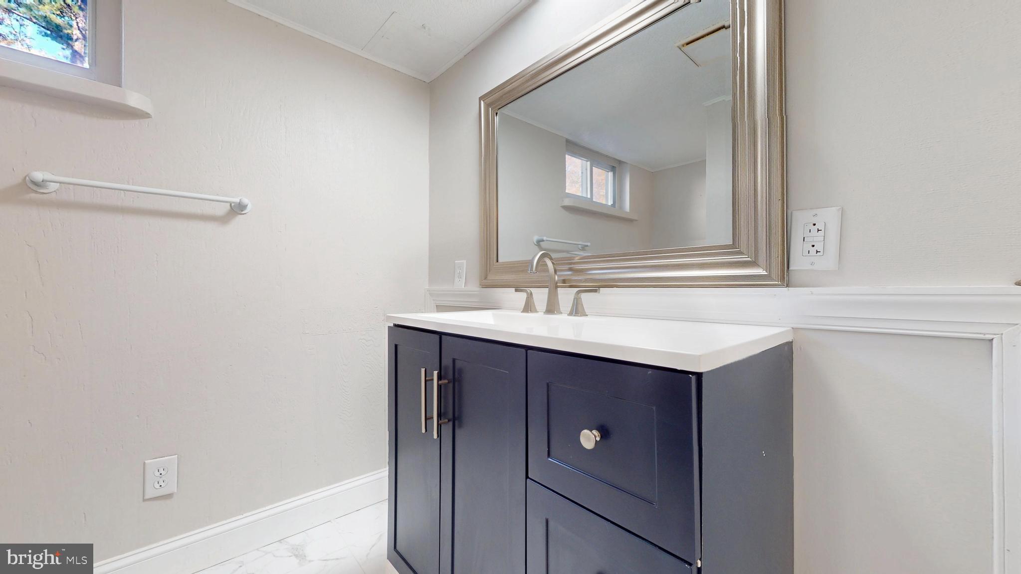 119 East Collings Drive Williamstown, NJ 08094 - Photo 28 of 61 a bathroom with a sink and a mirror