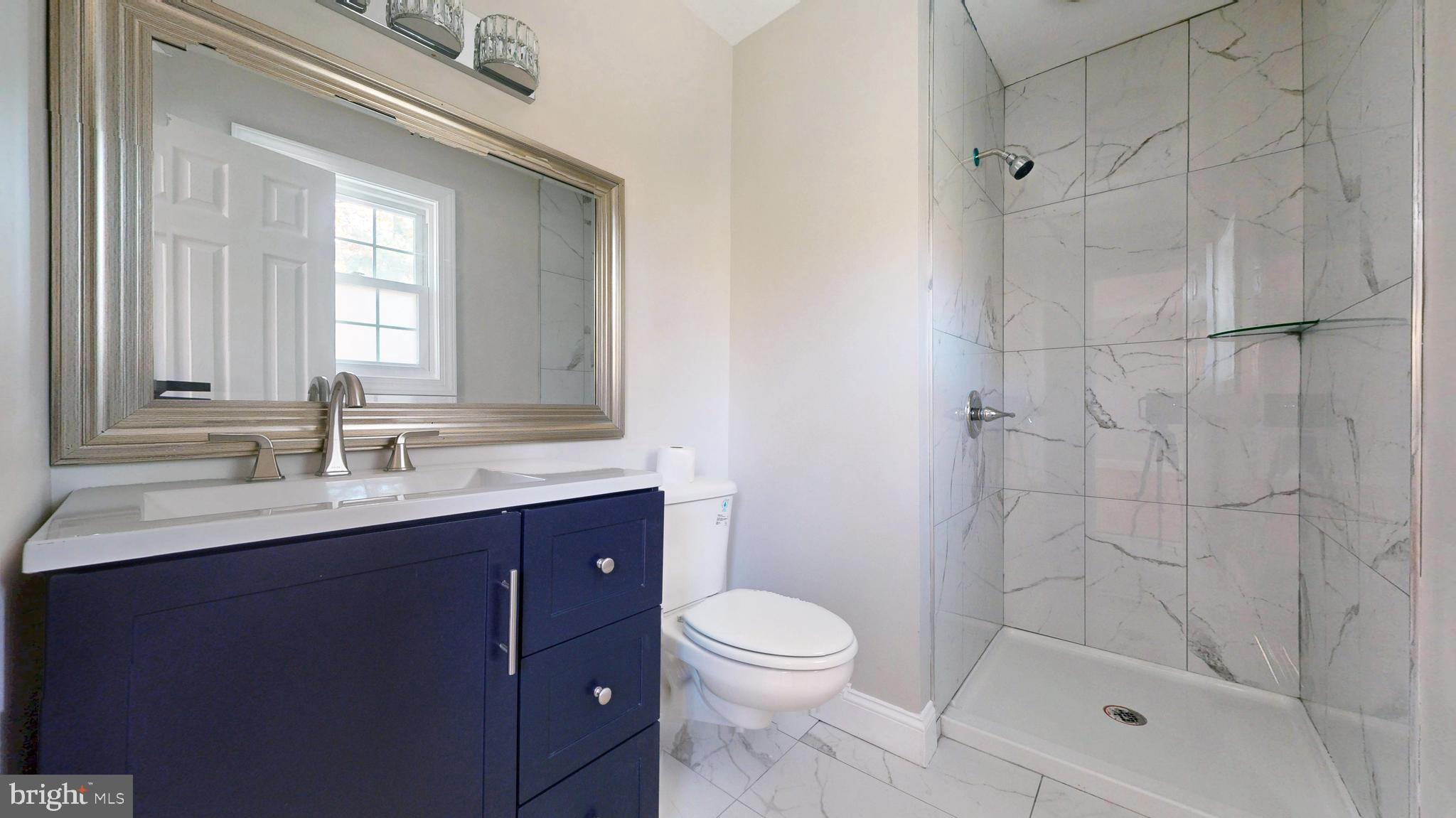 119 East Collings Drive Williamstown, NJ 08094 - Photo 29 of 61 a bathroom with a sink a toilet and shower