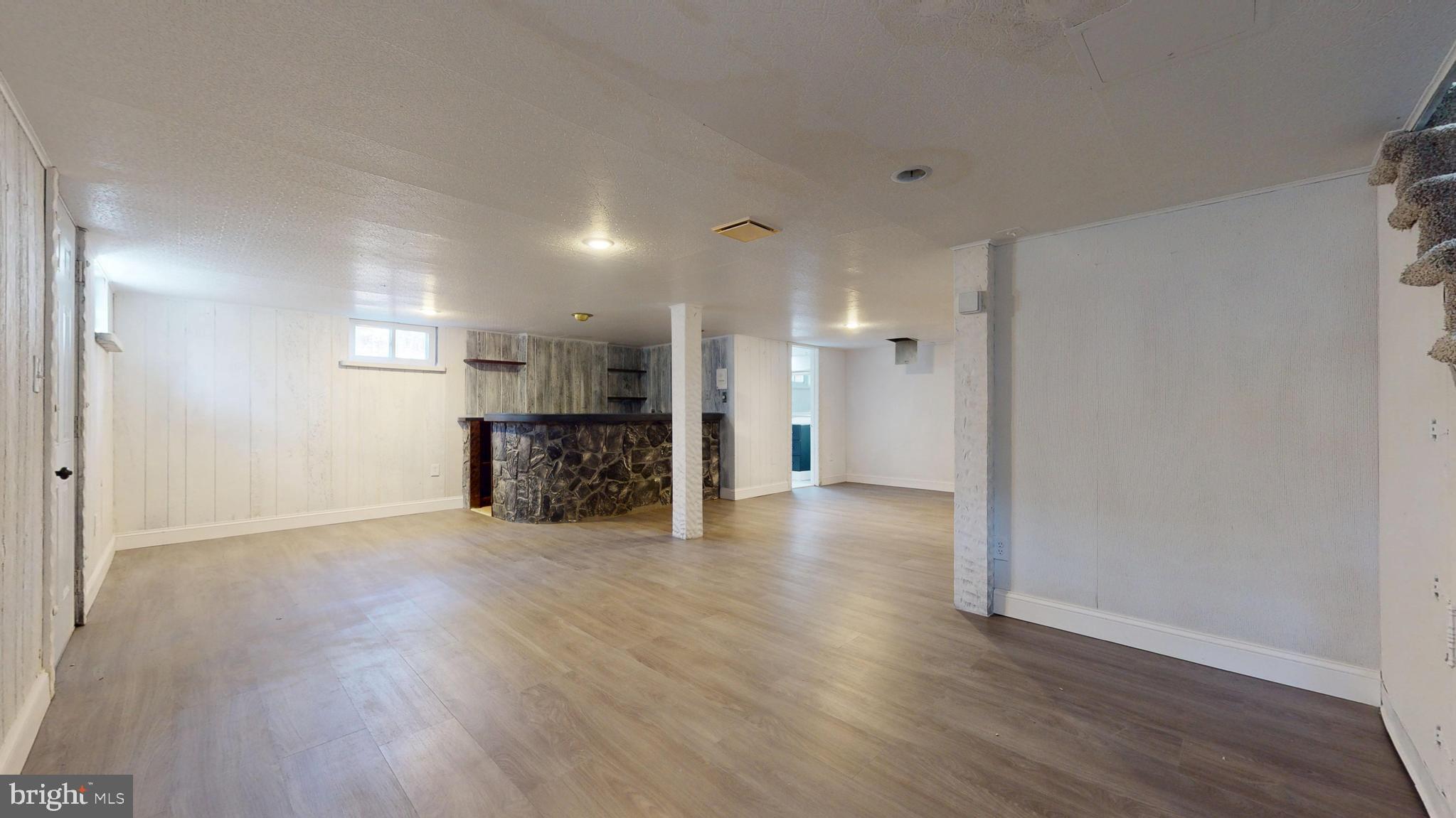 119 East Collings Drive Williamstown, NJ 08094 - Photo 32 of 61 a view of a big room with wooden floor and a kitchen