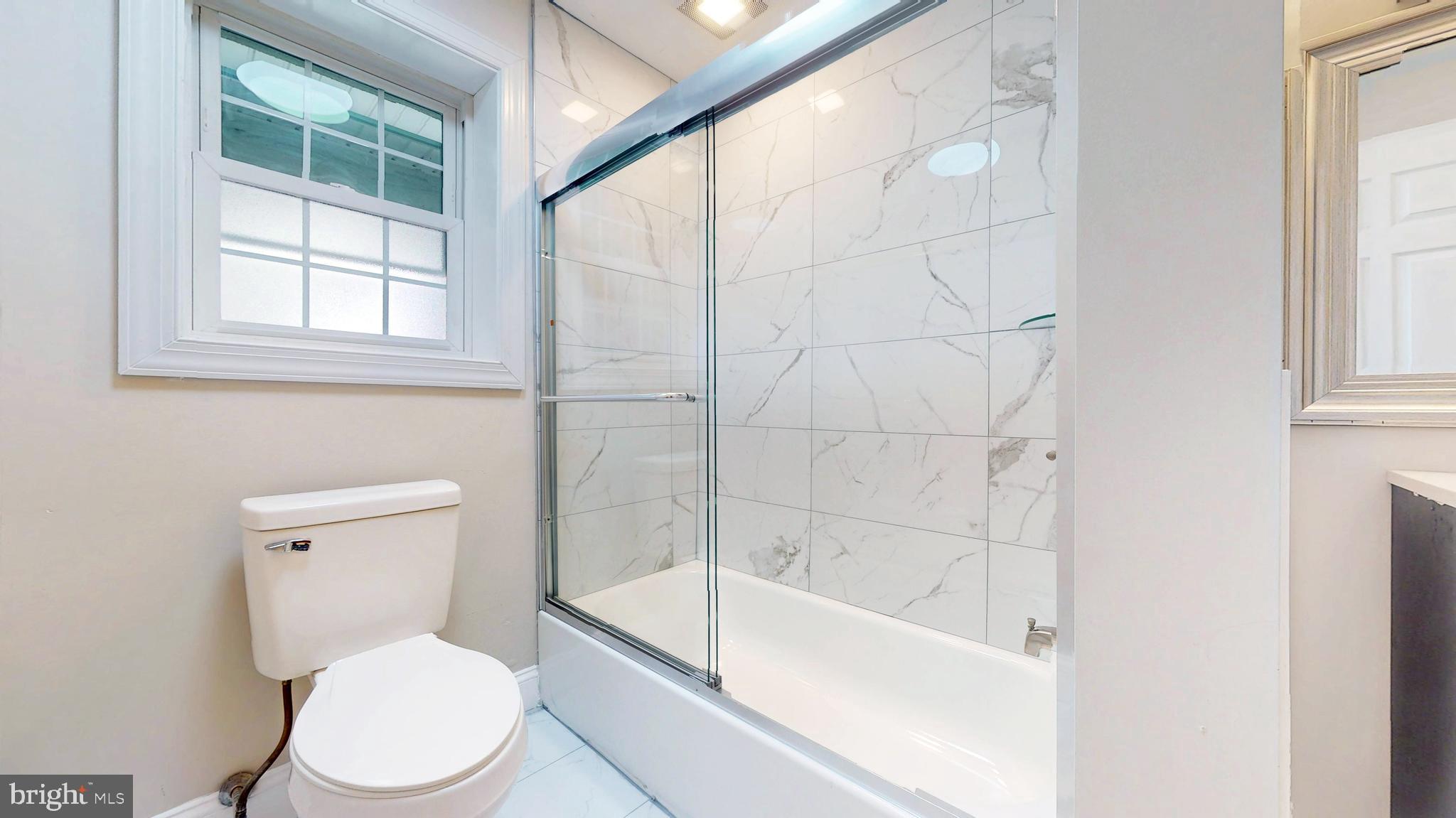 119 East Collings Drive Williamstown, NJ 08094 - Photo 33 of 61 a white toilet sitting next to a bath tub