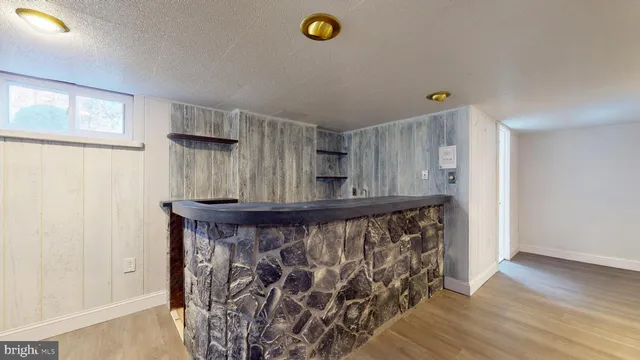 an aerial view of lake and residential houses with outdoor space