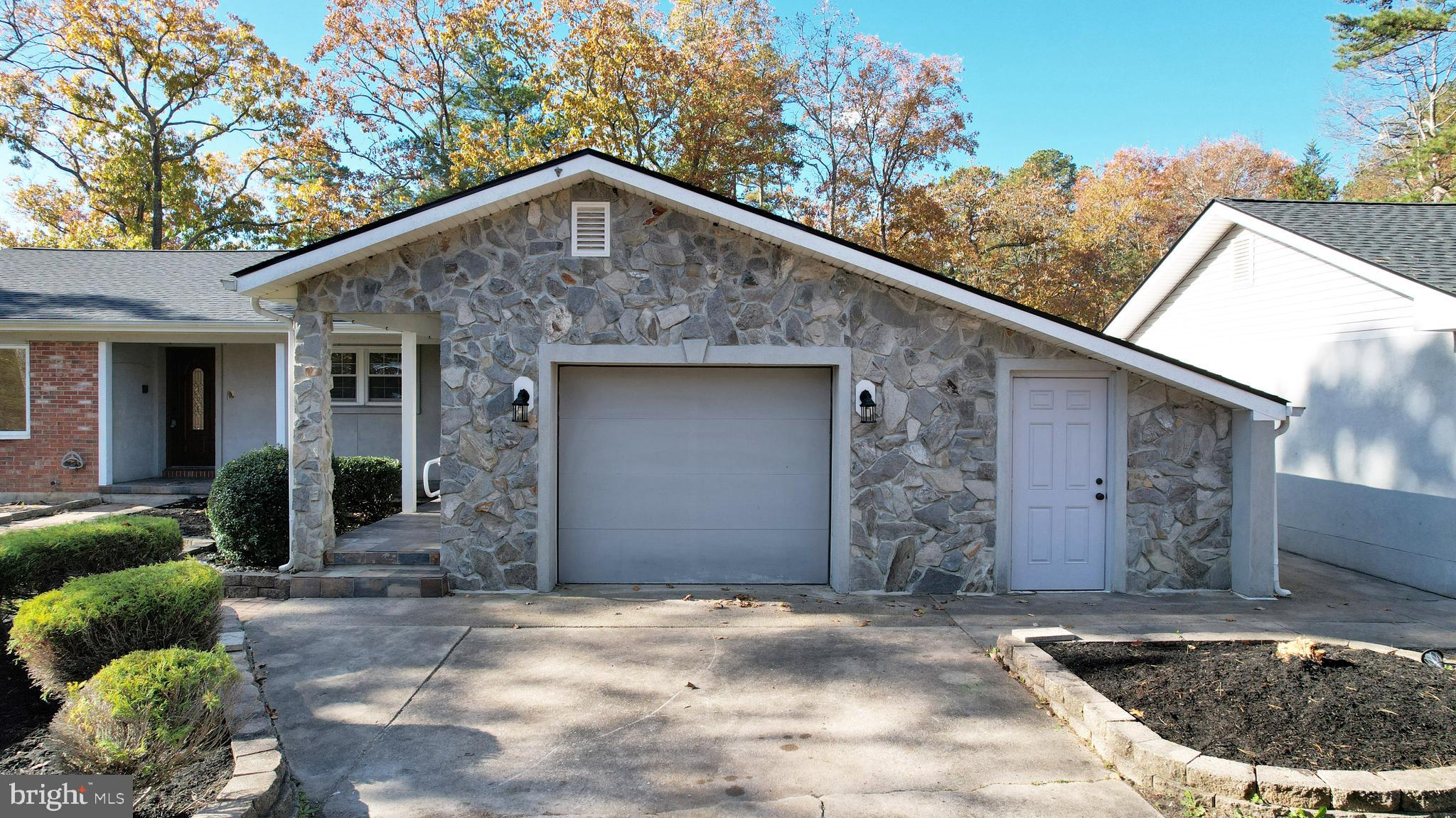 119 East Collings Drive Williamstown, NJ 08094 - Photo 59 of 61 a front view of a house with garden
