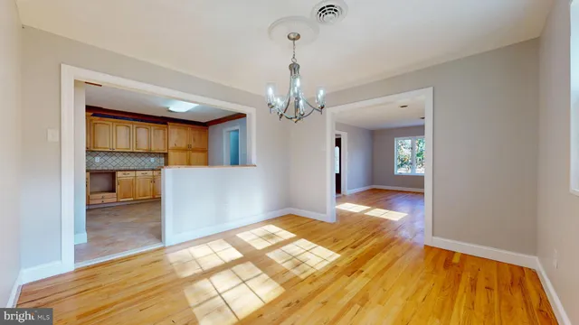 a view of kitchen with granite countertop cabinets and sink