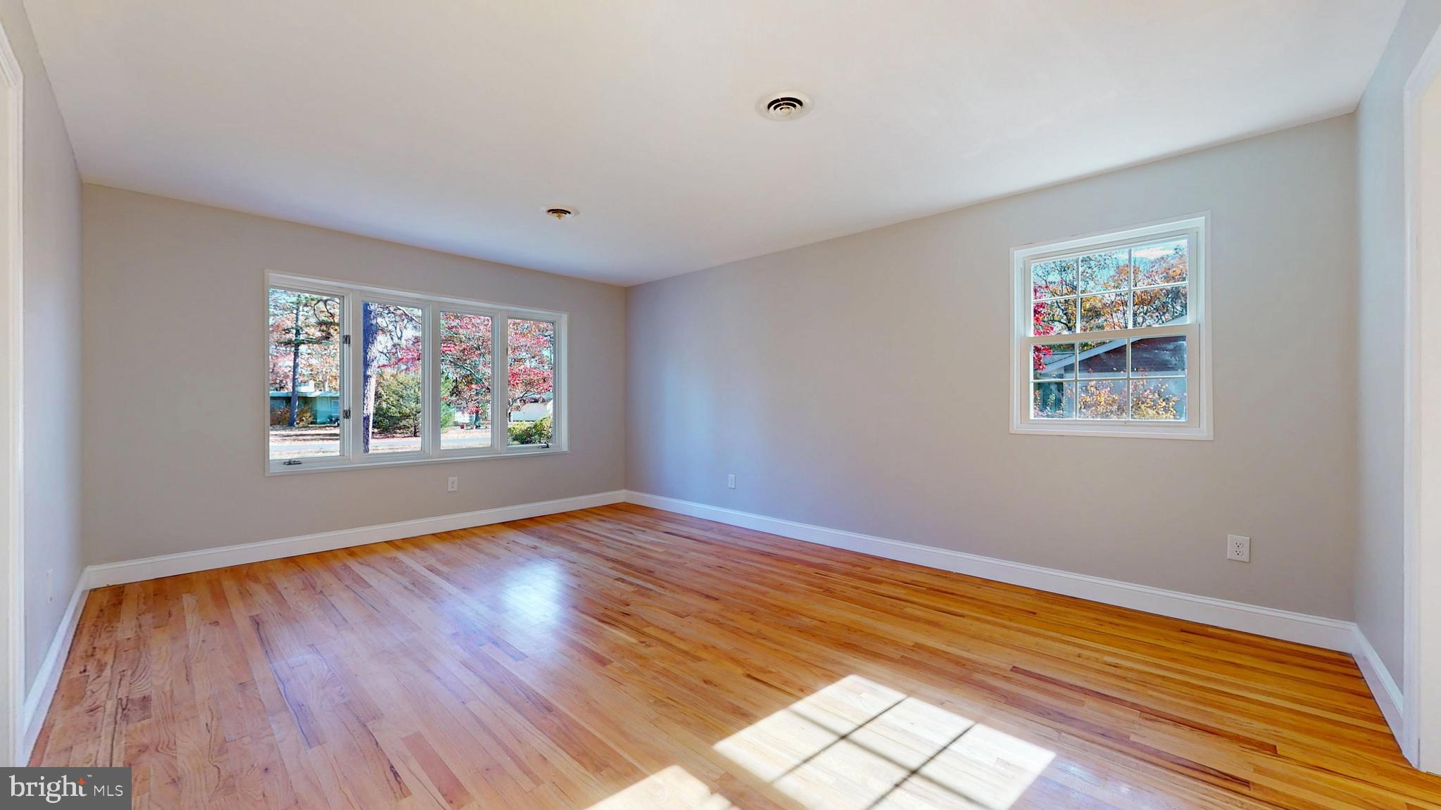 119 East Collings Drive Williamstown, NJ 08094 - Photo 10 of 61 a view of an empty room with wooden floor and window