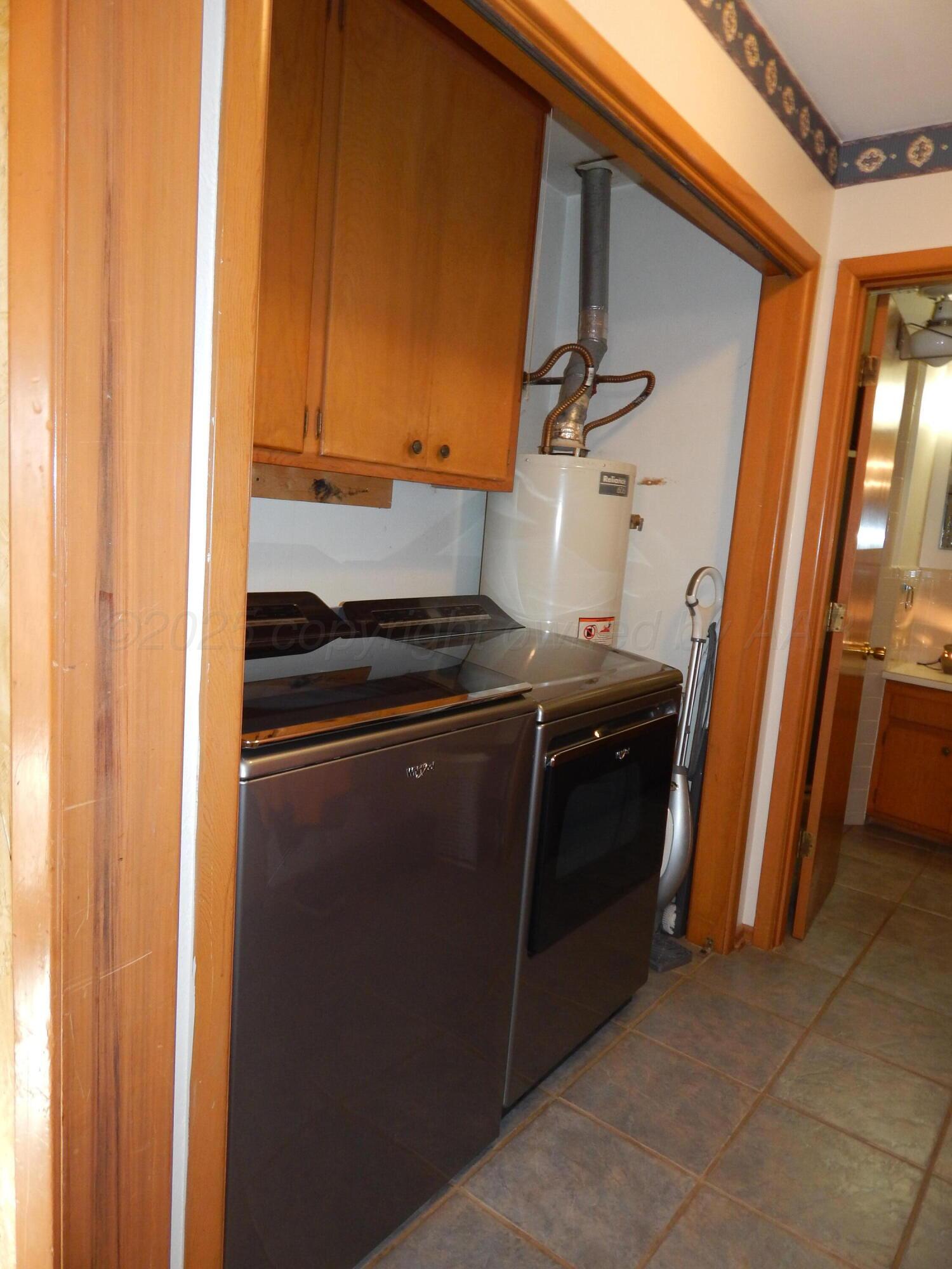 4205 Highway 83 Wellington, TX 79095 - Photo 11 of 52 a kitchen with a stove and a refrigerator