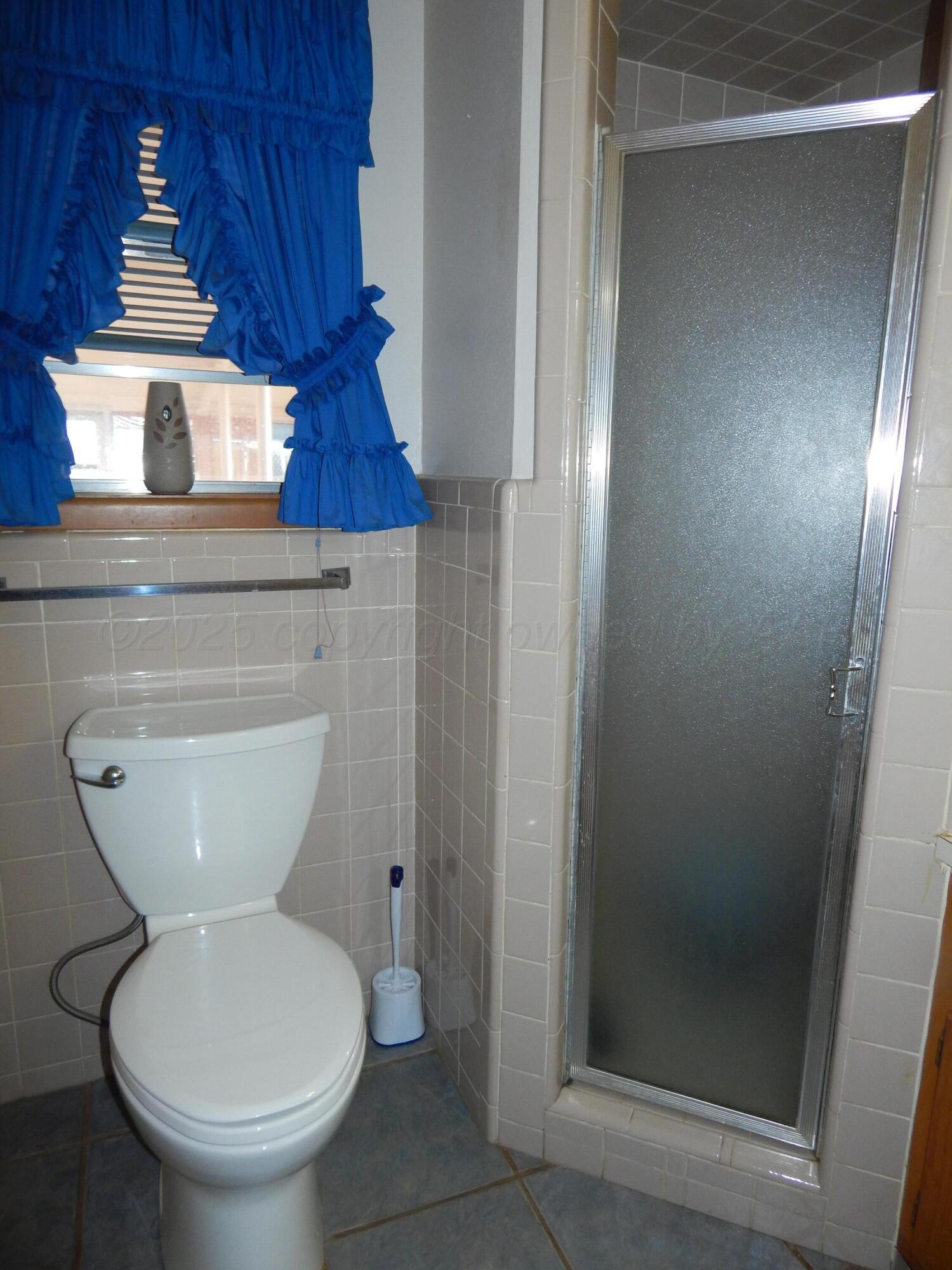 4205 Highway 83 Wellington, TX 79095 - Photo 12 of 52 a bathroom with a toilet and a sink