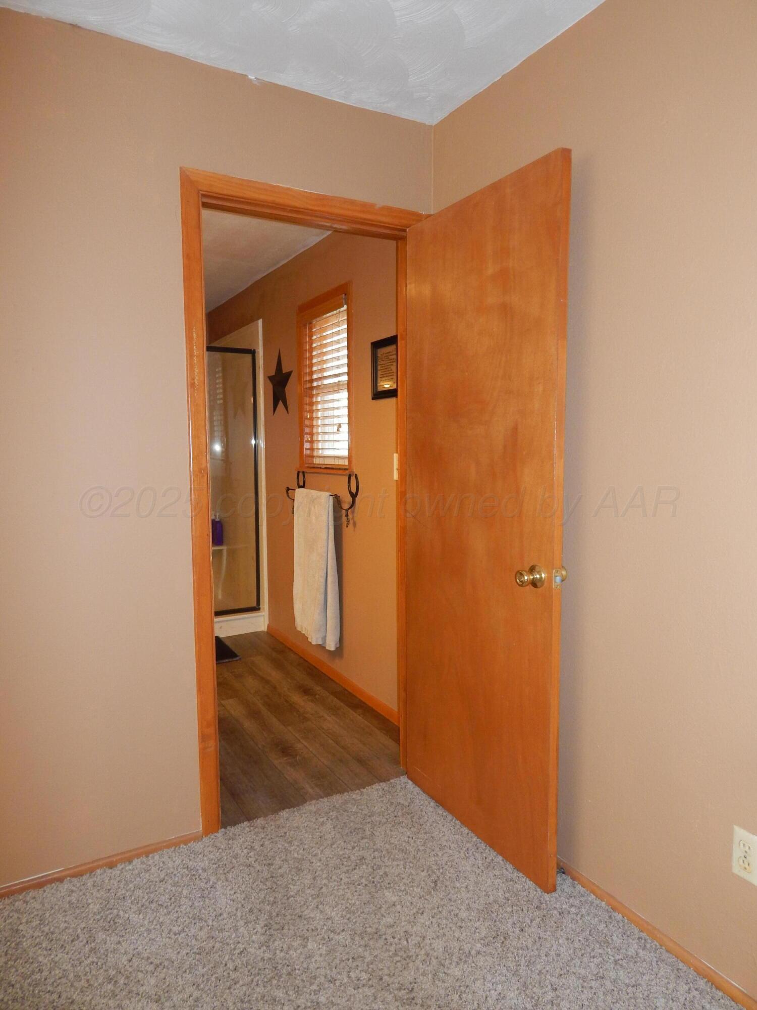 4205 Highway 83 Wellington, TX 79095 - Photo 27 of 52 a view of a hallway with wooden floor