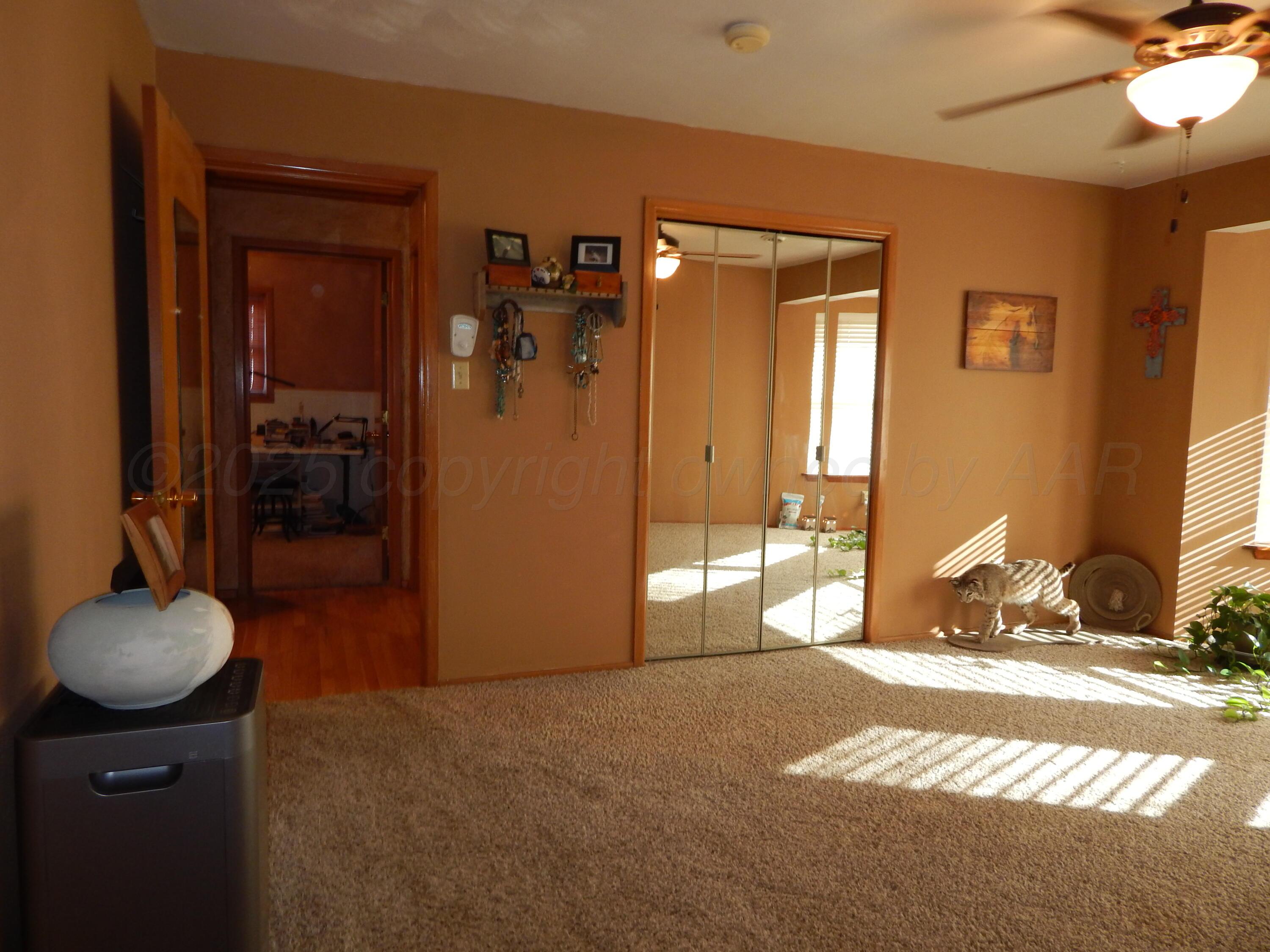 4205 Highway 83 Wellington, TX 79095 - Photo 30 of 52 a view of a livingroom with a chandelier and closet