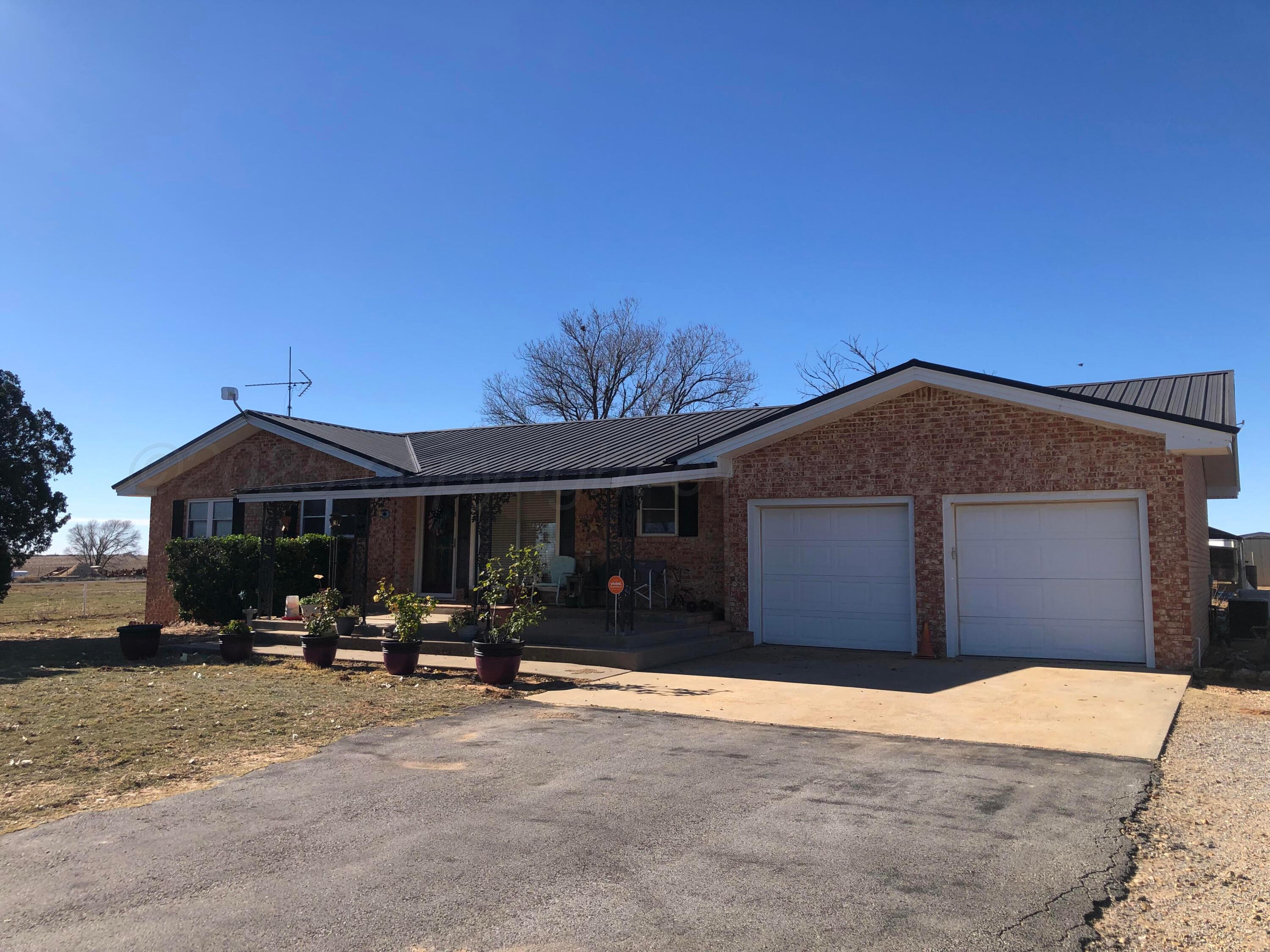4205 Highway 83 Wellington, TX 79095 - Photo 3 of 52 a front view of a house with cars