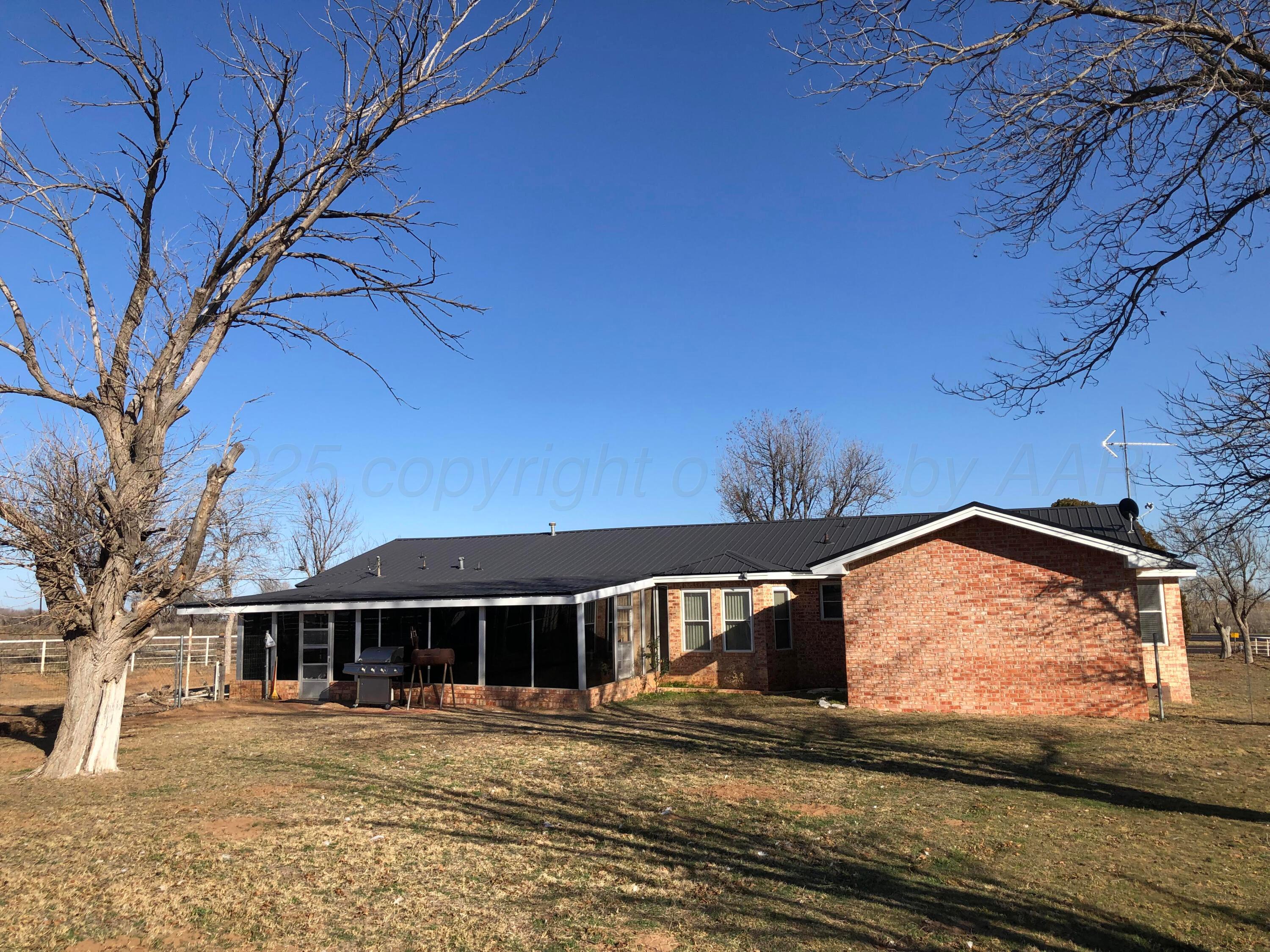4205 Highway 83 Wellington, TX 79095 - Photo 41 of 52 a front view of a house with a yard