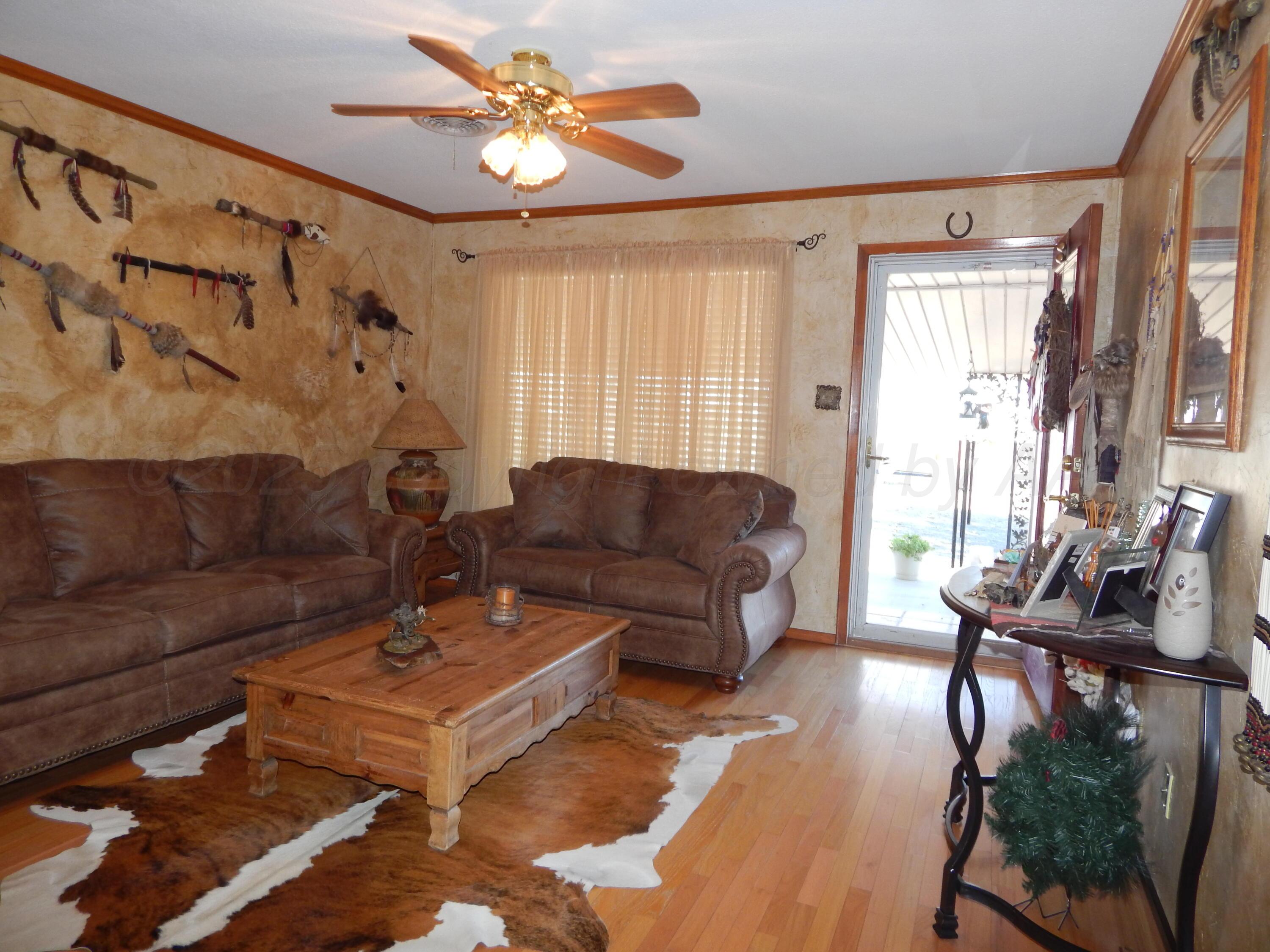 4205 Highway 83 Wellington, TX 79095 - Photo 6 of 52 a living room with furniture and a large window
