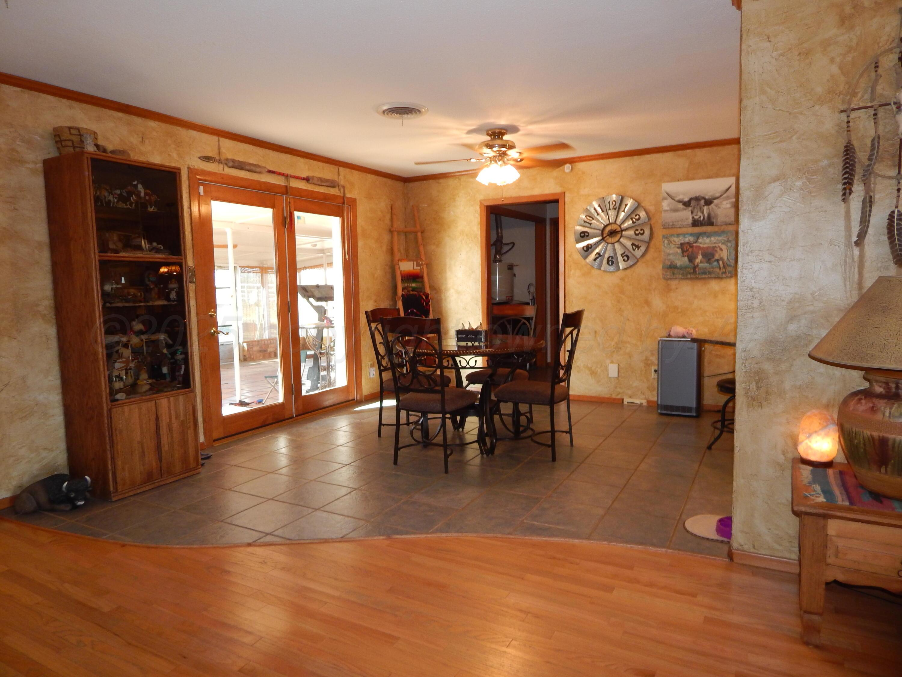 4205 Highway 83 Wellington, TX 79095 - Photo 7 of 52 a view of a dining room with furniture window and wooden floor