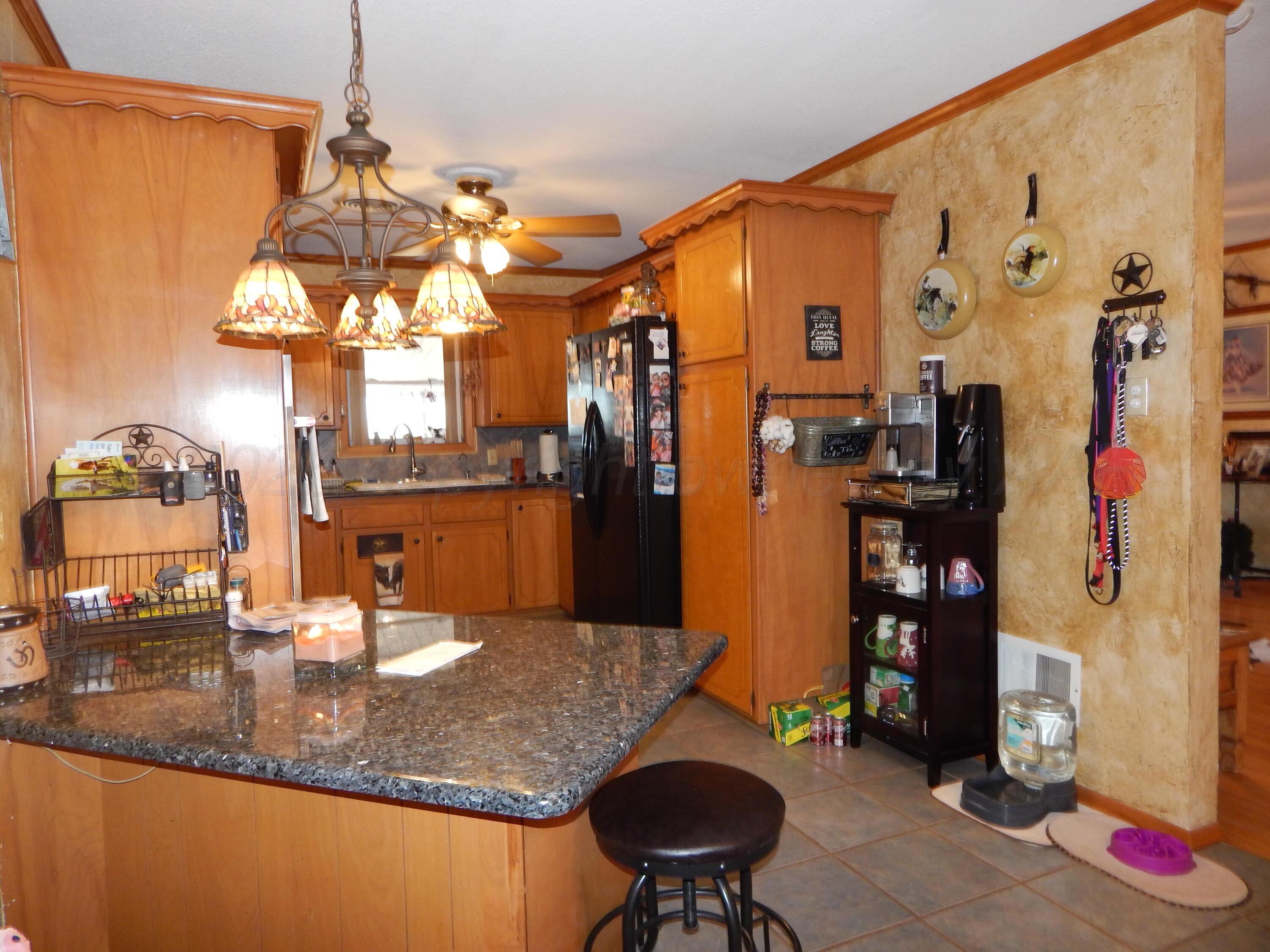 4205 Highway 83 Wellington, TX 79095 - Photo 8 of 52 a view of a living room and bathroom