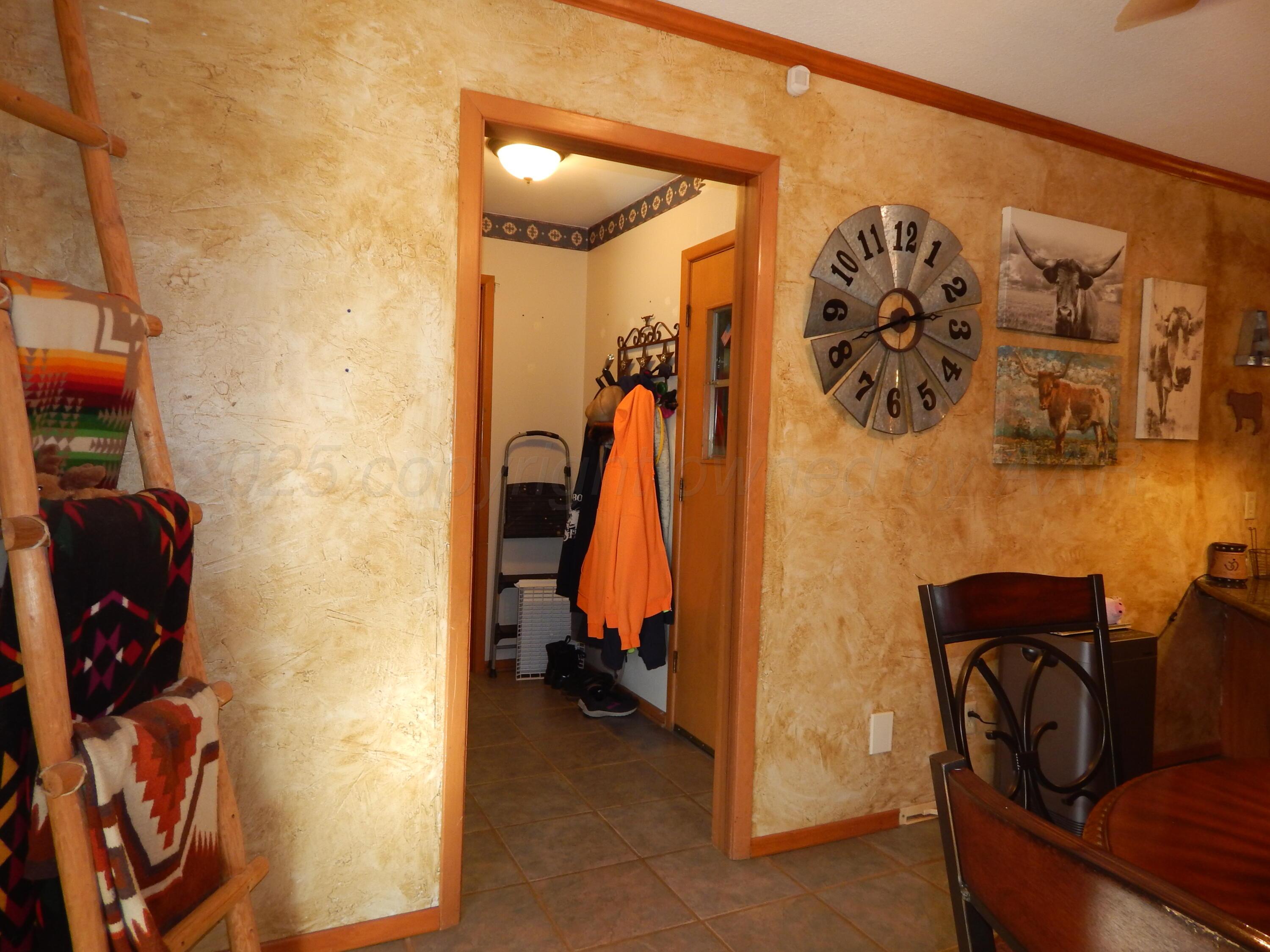 4205 Highway 83 Wellington, TX 79095 - Photo 10 of 52 a view of walk in closet with clothes and shoes