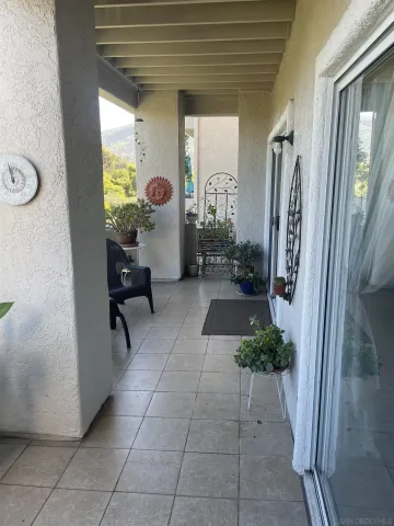 a lobby with furniture and a potted plant