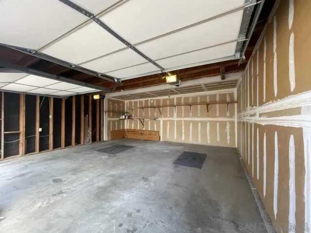 a view of an empty room with wooden walls