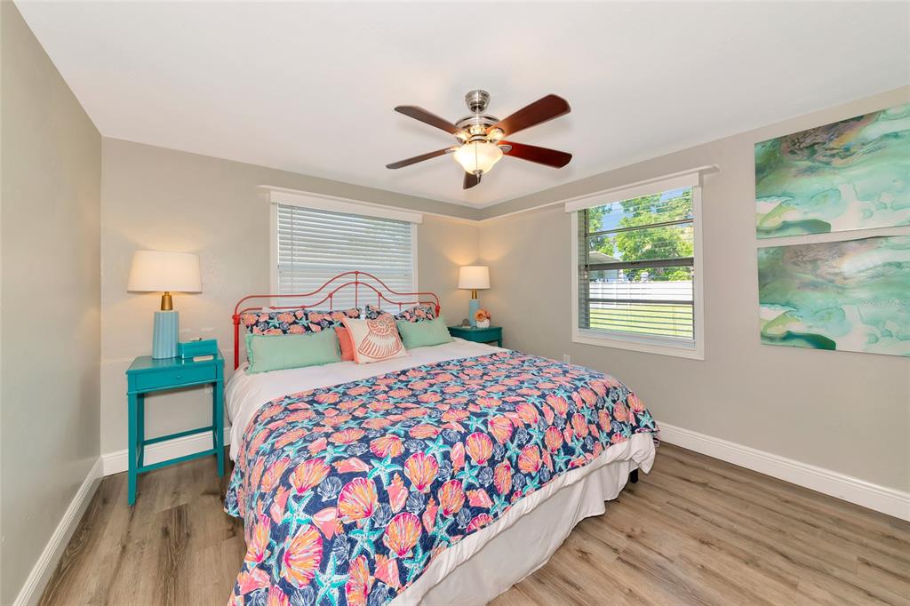 5948 Mirror Lake Road Sarasota, FL 34233 - Photo 13 of 50 a bedroom with a bed and a window