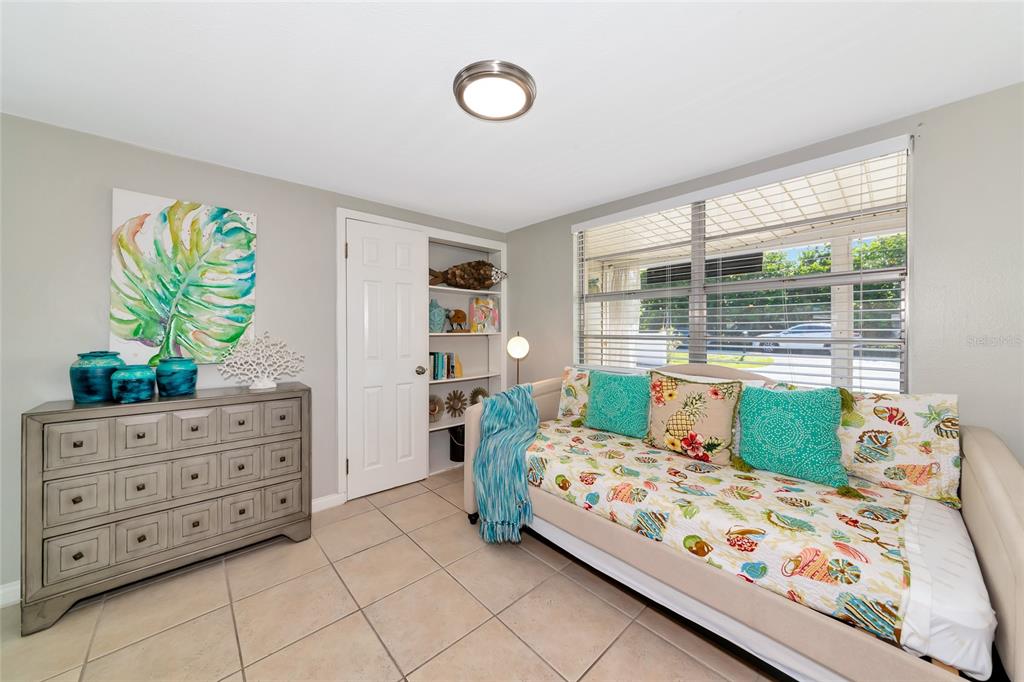 5948 Mirror Lake Road Sarasota, FL 34233 - Photo 16 of 50 a bedroom with a bed and a window