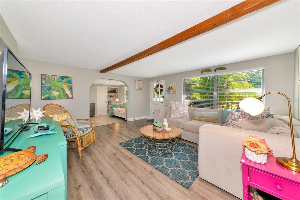 5948 Mirror Lake Road Sarasota, FL 34233 - Photo 23 of 50 a living room with furniture and a wooden floor