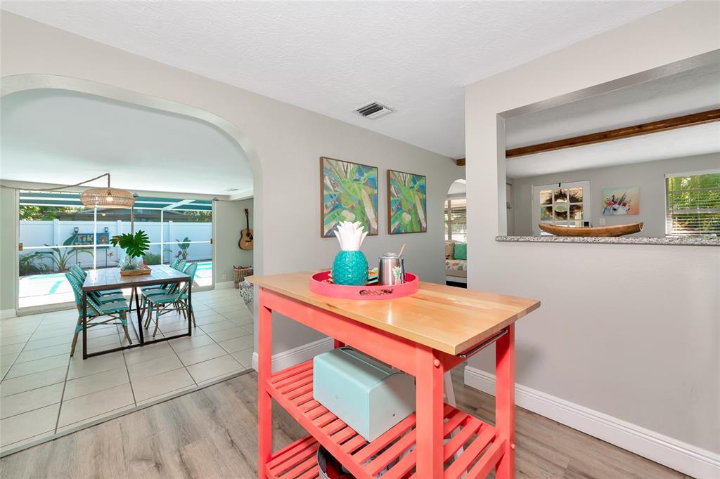 5948 Mirror Lake Road Sarasota, FL 34233 - Photo 26 of 50 a view of a dining room with furniture window and outside view